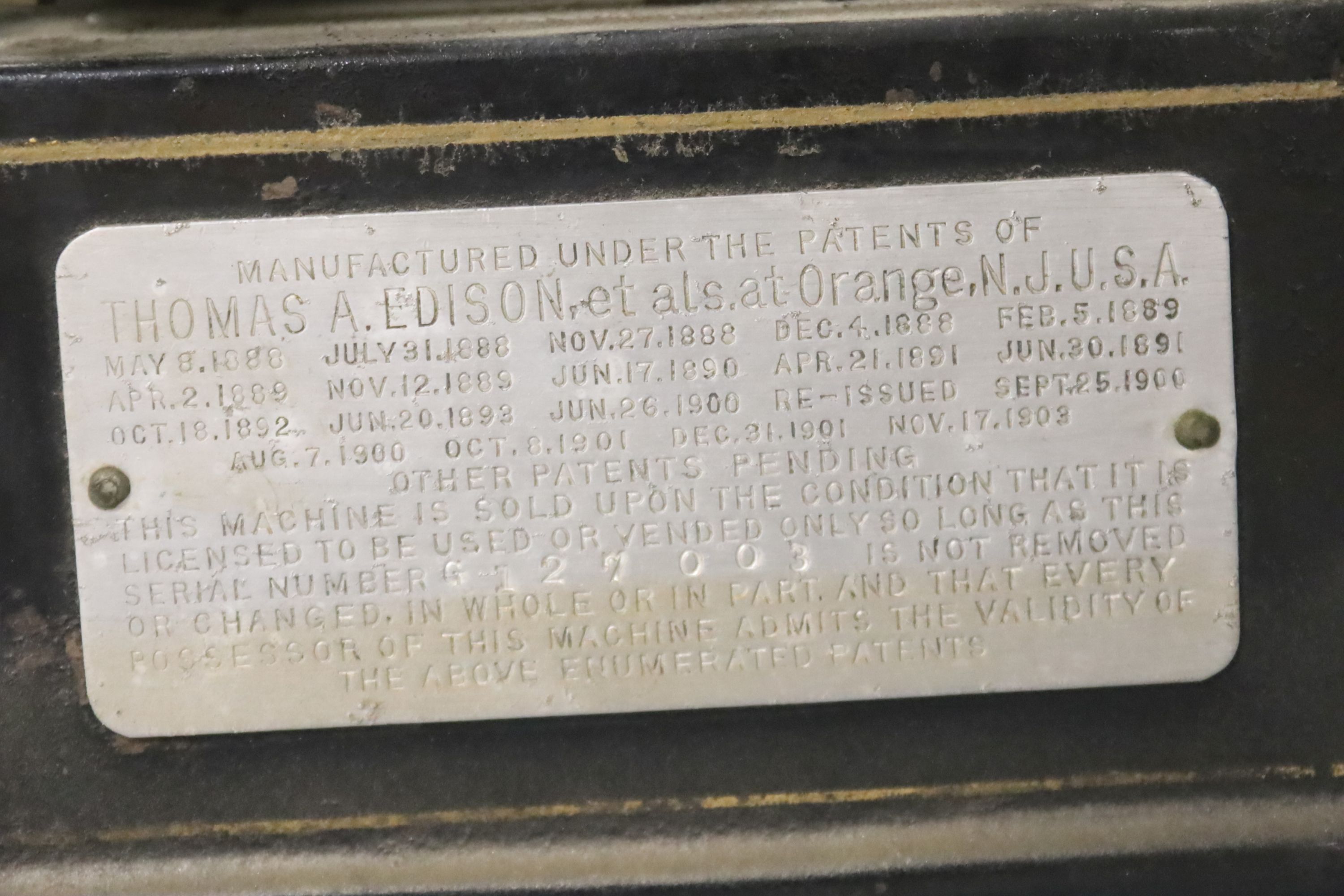 An Edison Gem phonograph, fitted with a horn, with original black and gilt bordered finish, 20cm wide, 15cm deep, 37cm high.